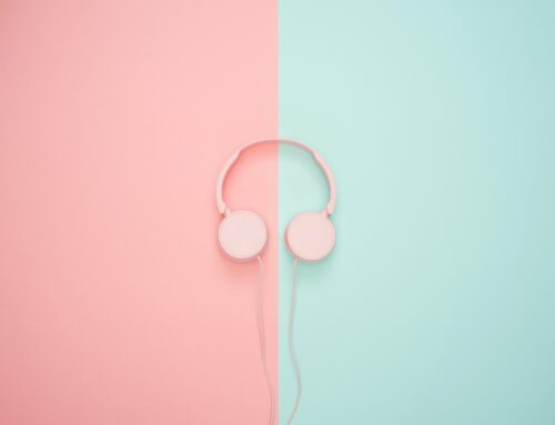 Pink headphones on a pastel background